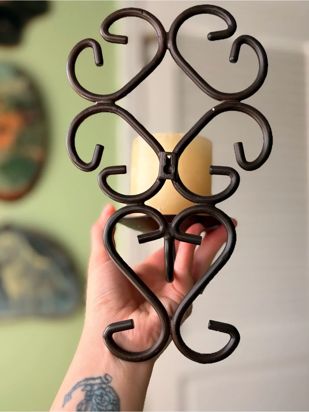 Vintage Metal Scroll Wall Candle Sconce with Cream Pillar Candle